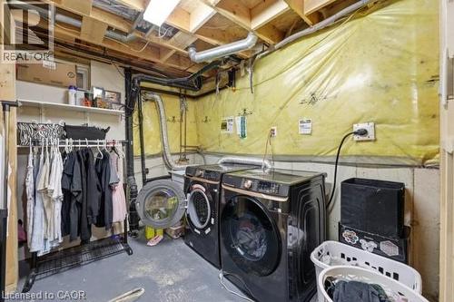 Dedicated utility space featuring exposed ceiling joists and visible ductwork - 16 Harrison Avenue, Hamilton, ON 