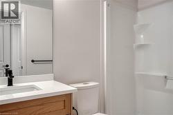 Full bath featuring vanity and a shower - 