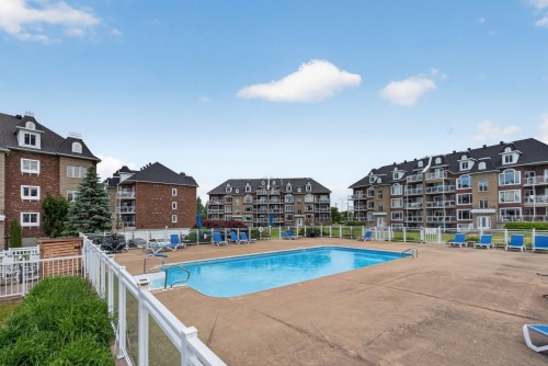 Piscine - 5-9300 Rue Rubaniers, Brossard, QC - Outdoor With In Ground Pool