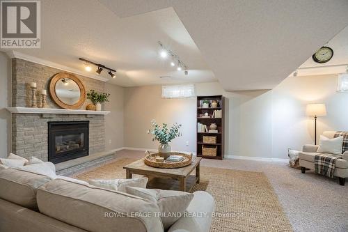 Virtually Staged. - 31 Neal Avenue, St. Thomas, ON - Indoor Photo Showing Living Room With Fireplace