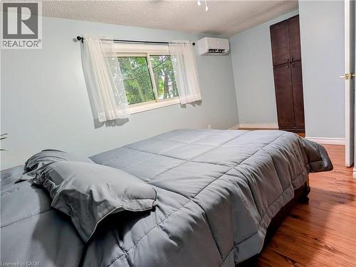 Spacious room featuring wood-finish flooring and light blue walls - 121 Morgan Avenue Unit# 7, Kitchener, ON 