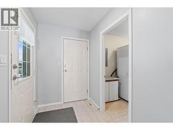 Front entry to laundry and single garage - 