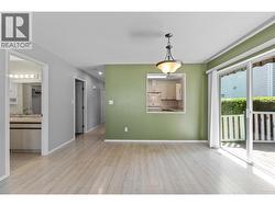 Dining Area with sliding glass door to back deck. - 