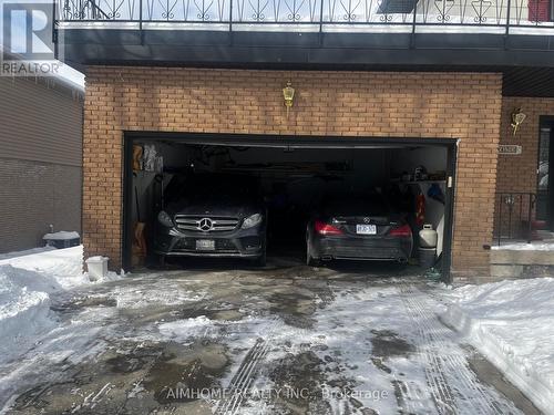 The garage with two cars in. - 23 Hildegard Drive, Hamilton, ON 