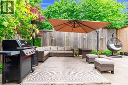 Expansive patio area featuring a concrete surface and a privacy fence - 