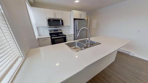 4816 52 Street, Wetaskiwin, AB - Indoor Photo Showing Kitchen With Double Sink With Upgraded Kitchen