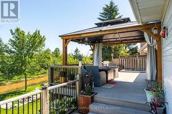 Cottage vibe backyard with hot tub - 