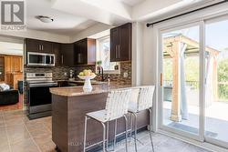 Stainless kitchen overlooking the creek and forest - 
