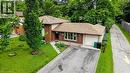 Brick and siding exterior featuring a multi-level roofline - 619 Forest Hill Drive, Kitchener, ON 