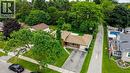 Split-level residence featuring a brown shingle roof, brick and siding exterior, and an attached two-car garage - 619 Forest Hill Drive, Kitchener, ON 