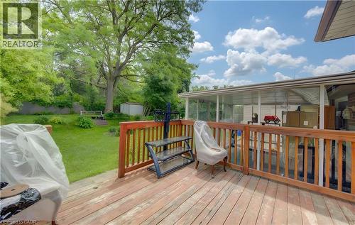 Spacious outdoor deck with wood-finish flooring and a matching wooden railing - 619 Forest Hill Drive, Kitchener, ON 