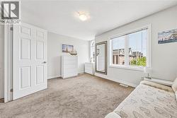 Neutral color palette with broadloom carpeting and white baseboards - 