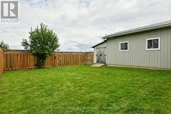 Great garden shed tucked behind garage - 