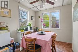 2nd Floor Room featuring multiple windows, a ceiling fan, and patterned floor tiling - 