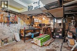 Utility room featuring exposed concrete walls and ceiling - 