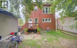 Red brick exterior with multiple windows - 