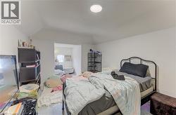 White walls with vaulted ceilings and recessed lighting - 