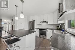 Stainless Steel Appliances, Bar Stools Included - 