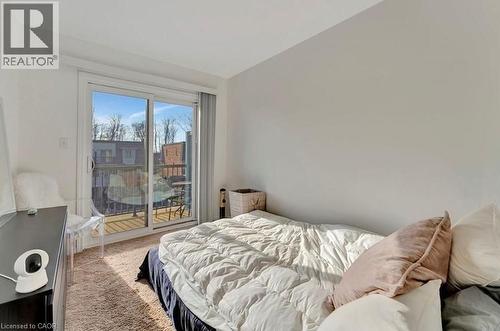 Room with sliding glass doors opening to an exterior balcony - 236 Rachel Crescent Unit# E, Kitchener, ON 