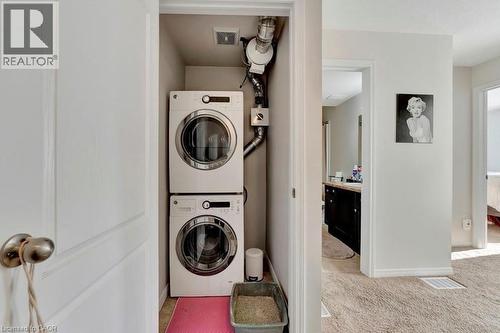 Dedicated laundry closet featuring a stacked washer and dryer - 236 Rachel Crescent Unit# E, Kitchener, ON 