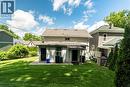 Expansive green lawn with mature perimeter landscaping - 66 Queen Street W, Cambridge, ON 