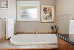 Main bathroom shows soaker tub - 