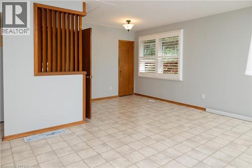 Light gray walls complement the window with white plantation shutters - 156 Mutual Street N, Ingersoll, ON 