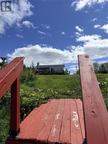 Beach looking to House - 321 Main Road, Snooks Harbour, NL 