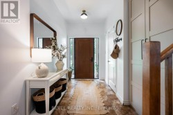 Welcoming Foyer w/ Load of Storage - 