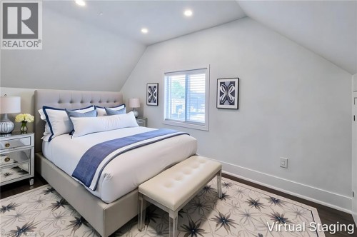 Bright room featuring sloped ceilings, recessed lighting, and dark wood-finish flooring - 78 Hillyard Street, Hamilton, ON 