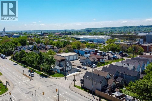 Aerial perspective showcasing a residential area with varied housing styles and mature tree cover - 78 Hillyard Street, Hamilton, ON 