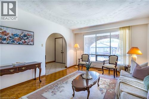 Cozy sitting area framed by oversized windows - 102 Markson Crescent, Hamilton, ON 