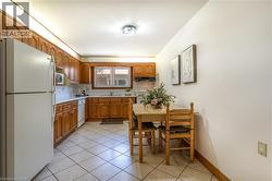 Functional eat-in kitchen w/ natural wood cabinets - 