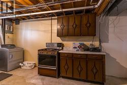 Gas kitchen and laundry great for in-law suite - 