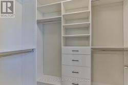 Primary walk in closet with custom upgrade - 