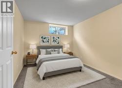 VIRTUALLY STAGED BEDROOM ON LOWER LEVEL - 