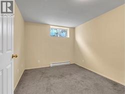 BEDROOM ON LOWER LEVEL AS IS - 