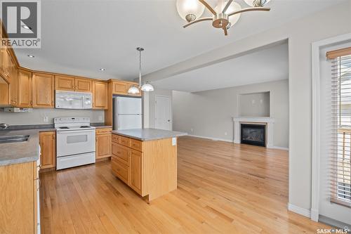51 1600 Muzzy Drive, Prince Albert, SK - Indoor Photo Showing Kitchen With Fireplace With Double Sink