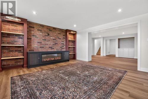 Brick Feature Wall w/Built-in Shelves - 930 Marshall Road, Tiny, ON 