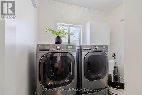 Laundry room with window and high-end set - 19 Black Tern Crescent, Ottawa, ON 