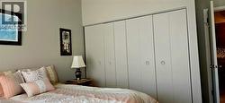 Wall-to-wall bi-fold closet doors offering ample storage - 