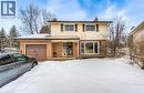 Two-story residence featuring a brick and siding exterior, an attached garage with a brown door, and a prominent front window - 110 Wren Place Unit# Upper, Kitchener, ON  - Outdoor 