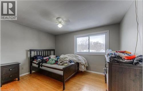 Room with wood-finish flooring, light grey painted walls, and a ceiling fan with light fixture - 110 Wren Place Unit# Upper, Kitchener, ON - Indoor Photo Showing Bedroom