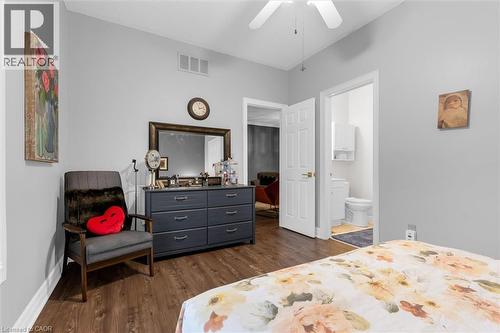 Interior room featuring wood-finish flooring and light gray painted walls - 149 Silverbirch Boulevard, Hamilton, ON 