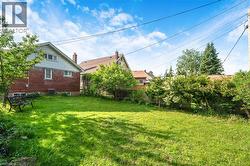 Expansive green lawn provides ample outdoor living space - 