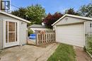 Detached garage with white panel door - 81 Vale Avenue, St. Catharines, ON 