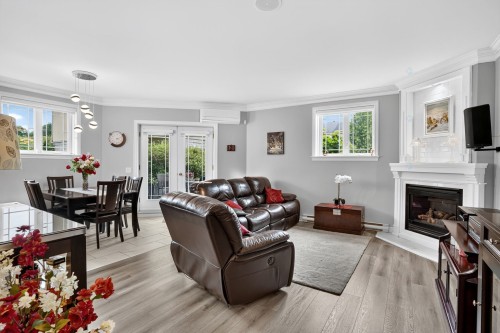 Living Room - 2-2401 Boul. Lafontaine, Saint-Jérôme, QC - Indoor Photo Showing Living Room With Fireplace