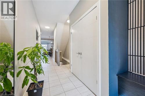 Entryway featuring light-toned tile flooring and white walls - 907 Robert Ferrie Drive, Kitchener, ON 