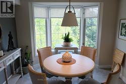 updated contemporary dining area with bay window - 