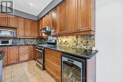Gourmet Kitchen Equipped with Granite Countertops - 